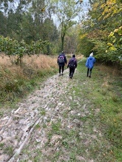 Bourne Woods - A group of people on a muddy path.