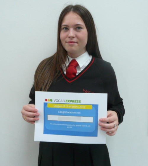 Year 10 student holding her Vocab Express certificate 